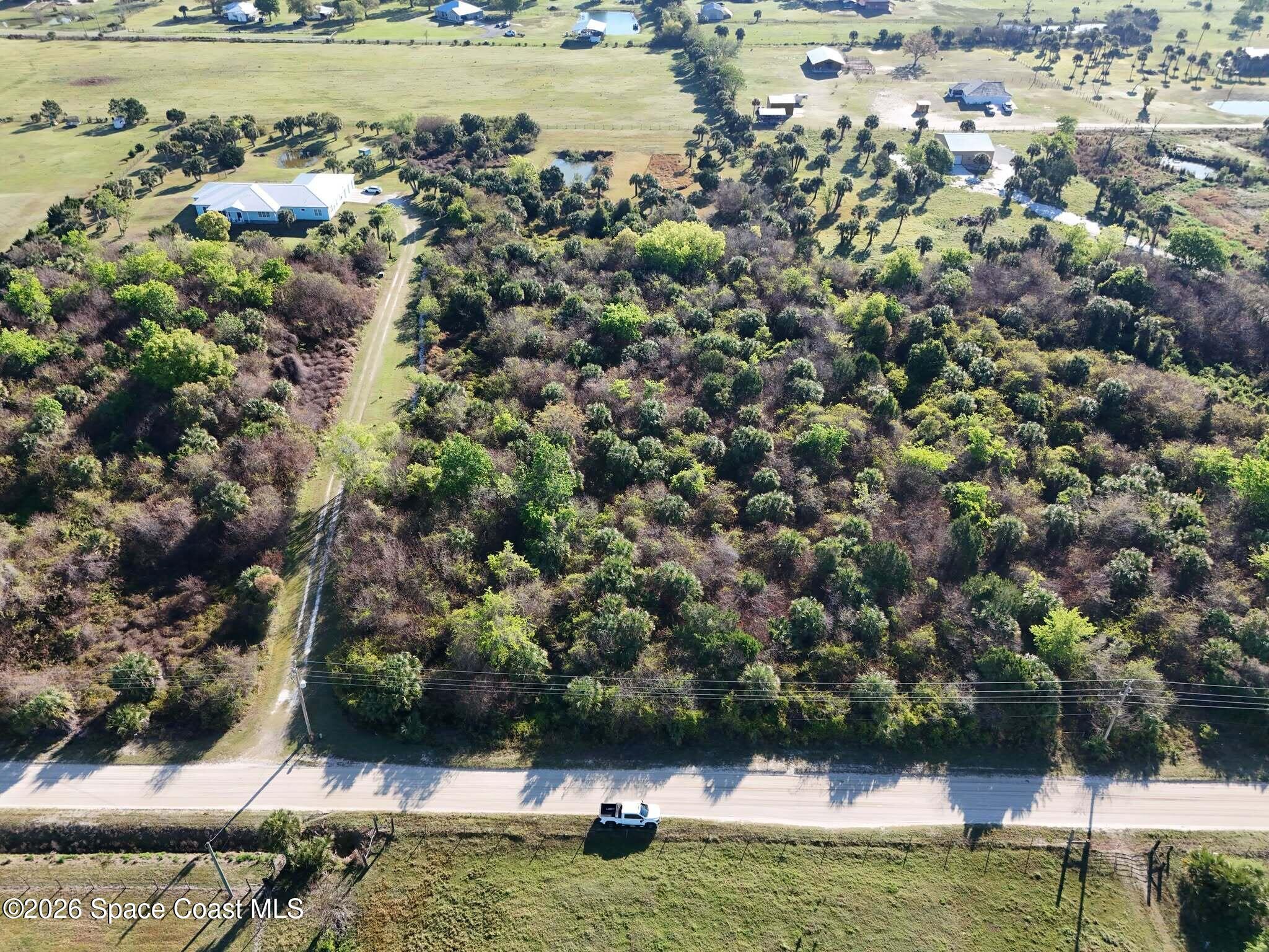 6215 Dixie Way Mims, FL 32754 - Photo 1 of 5 a view of a lake with houses