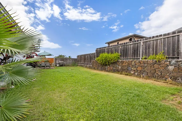 a bedroom with a bed and a dresser next to a window