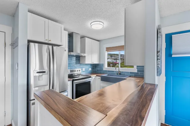 a kitchen with a sink and a large window