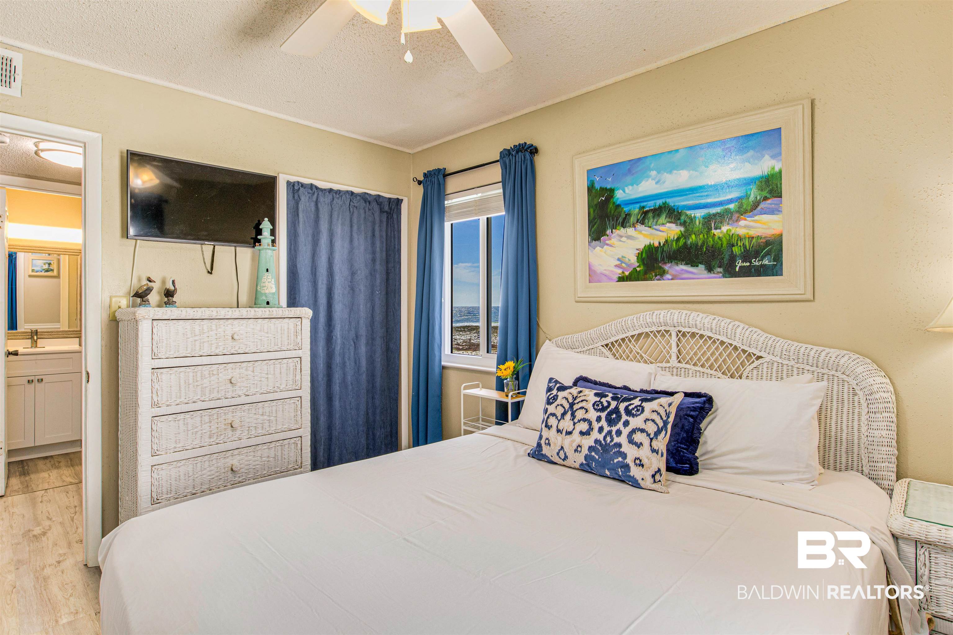 400 Plantation Road, Unit 1303 Gulf Shores, AL 36542 - Photo 8 of 24 Bedroom with ceiling fan, vinyl flooring, & fully furnished