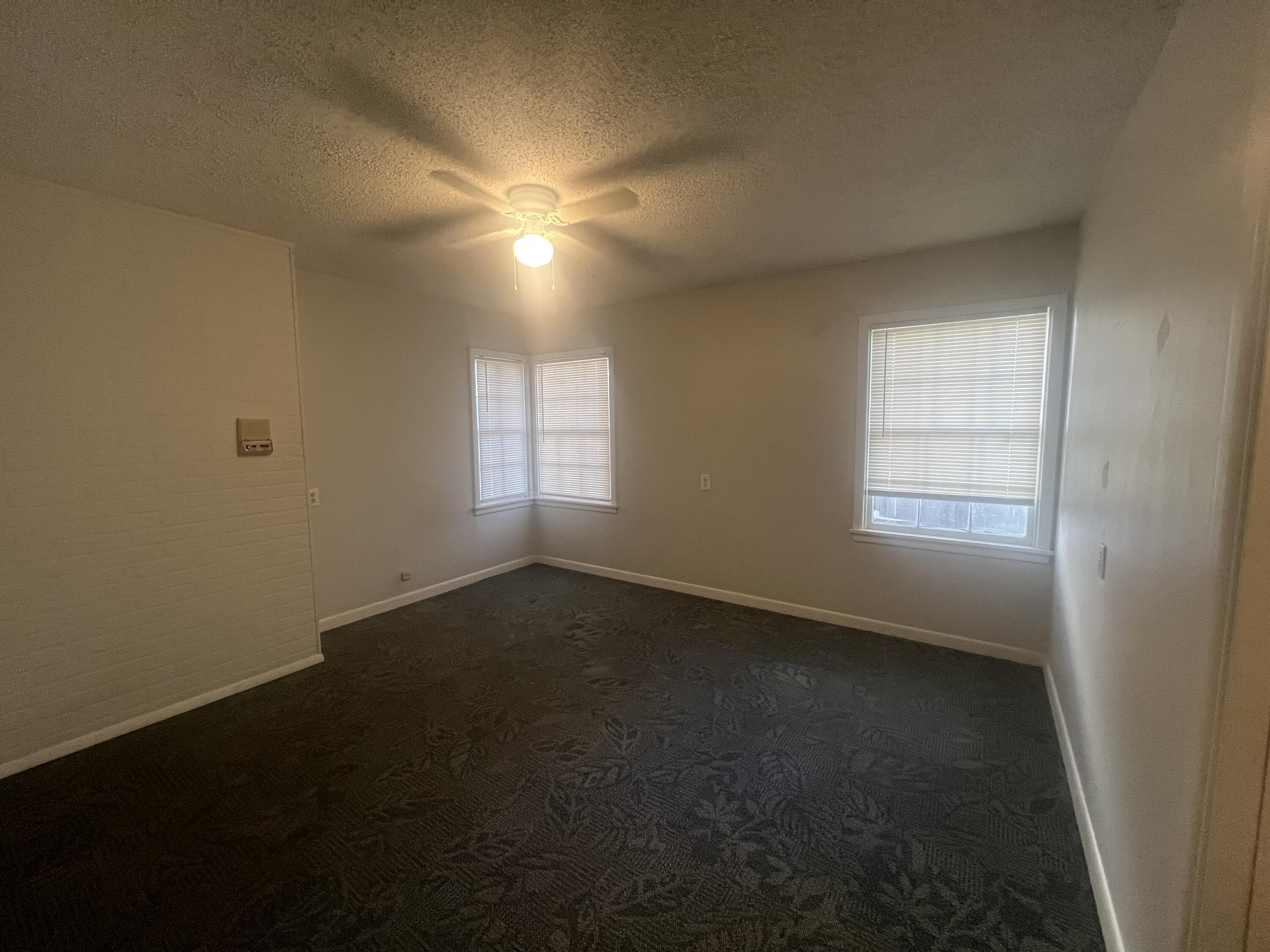 2424 33rd Street Lubbock, TX 79411 - Photo 12 of 23 a view of an empty room with a window