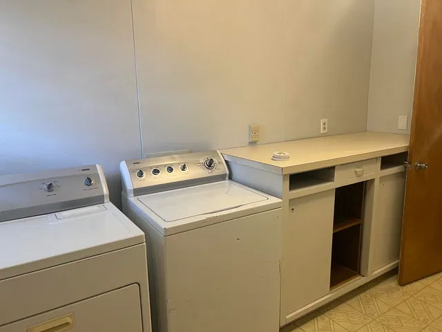 a utility room with dryer and washer