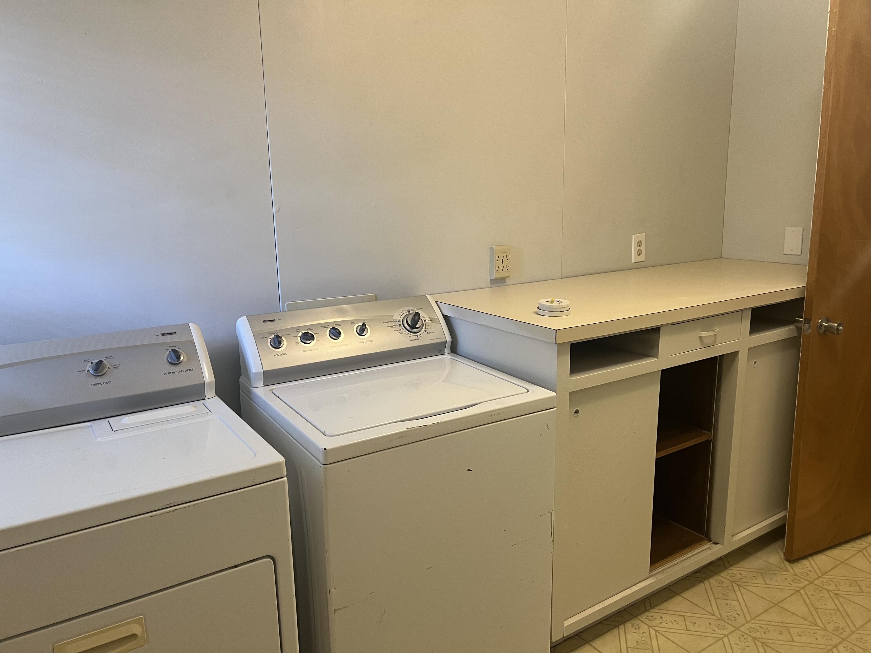 2424 33rd Street Lubbock, TX 79411 - Photo 15 of 23 a utility room with dryer and washer