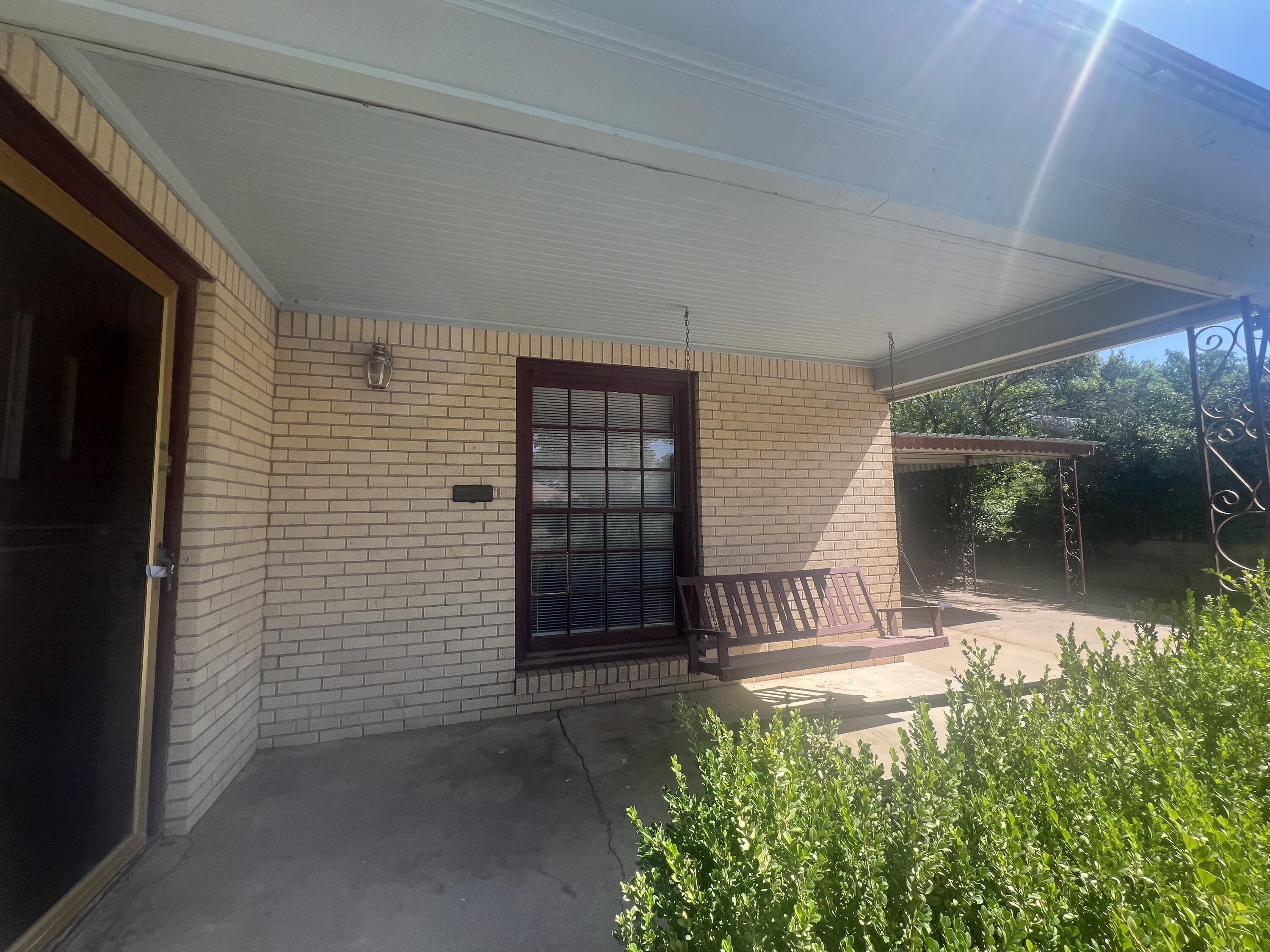 2424 33rd Street Lubbock, TX 79411 - Photo 2 of 23 a front view of a house with a garden
