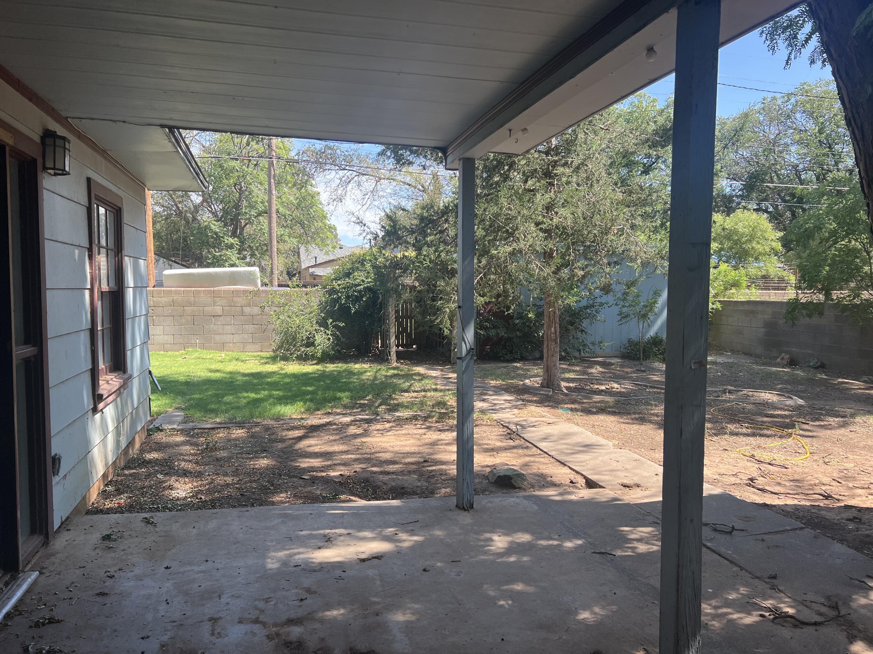 2424 33rd Street Lubbock, TX 79411 - Photo 22 of 23 a view of a yard with porch