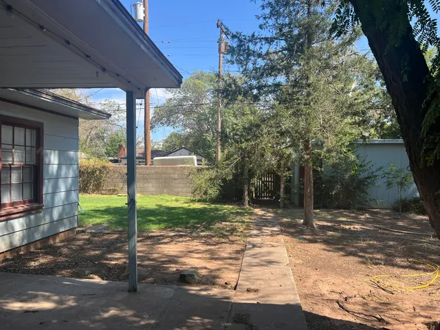 a backyard of a house with lots of green space