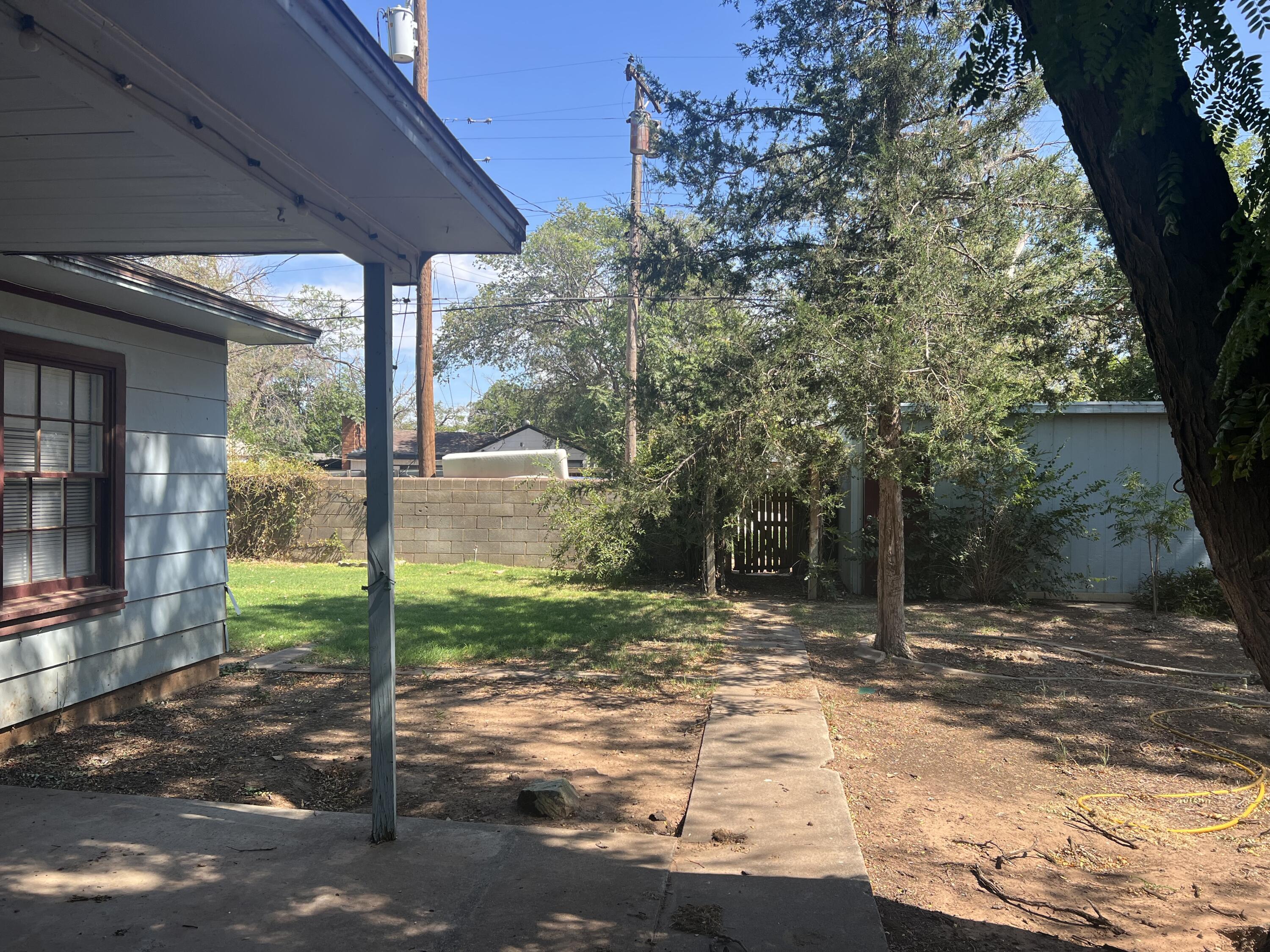 2424 33rd Street Lubbock, TX 79411 - Photo 23 of 23 a backyard of a house with lots of green space