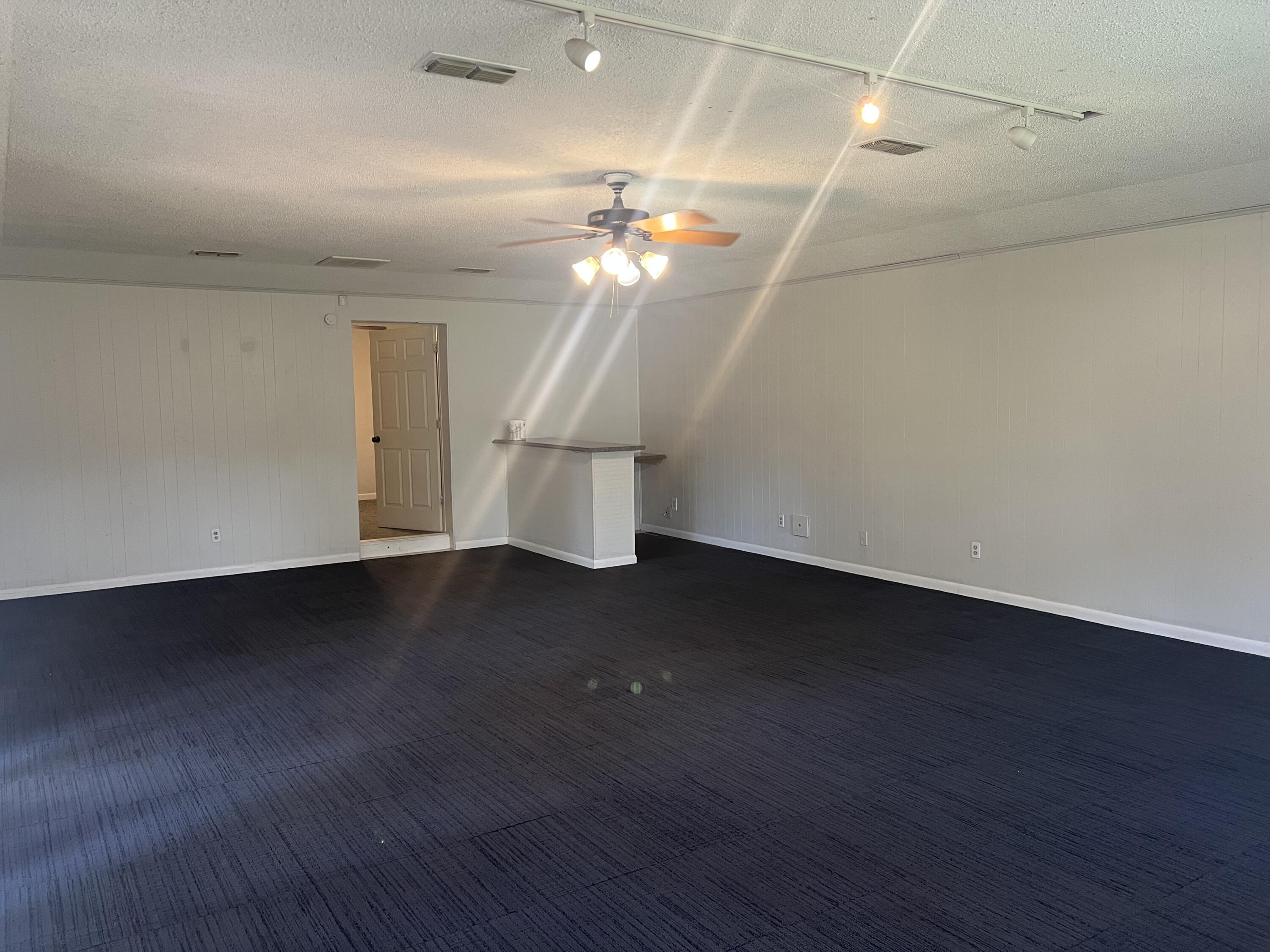 2424 33rd Street Lubbock, TX 79411 - Photo 6 of 23 a view of entryway and hall with wooden floor