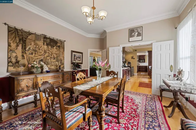 a living room with furniture a bookshelf and a large window