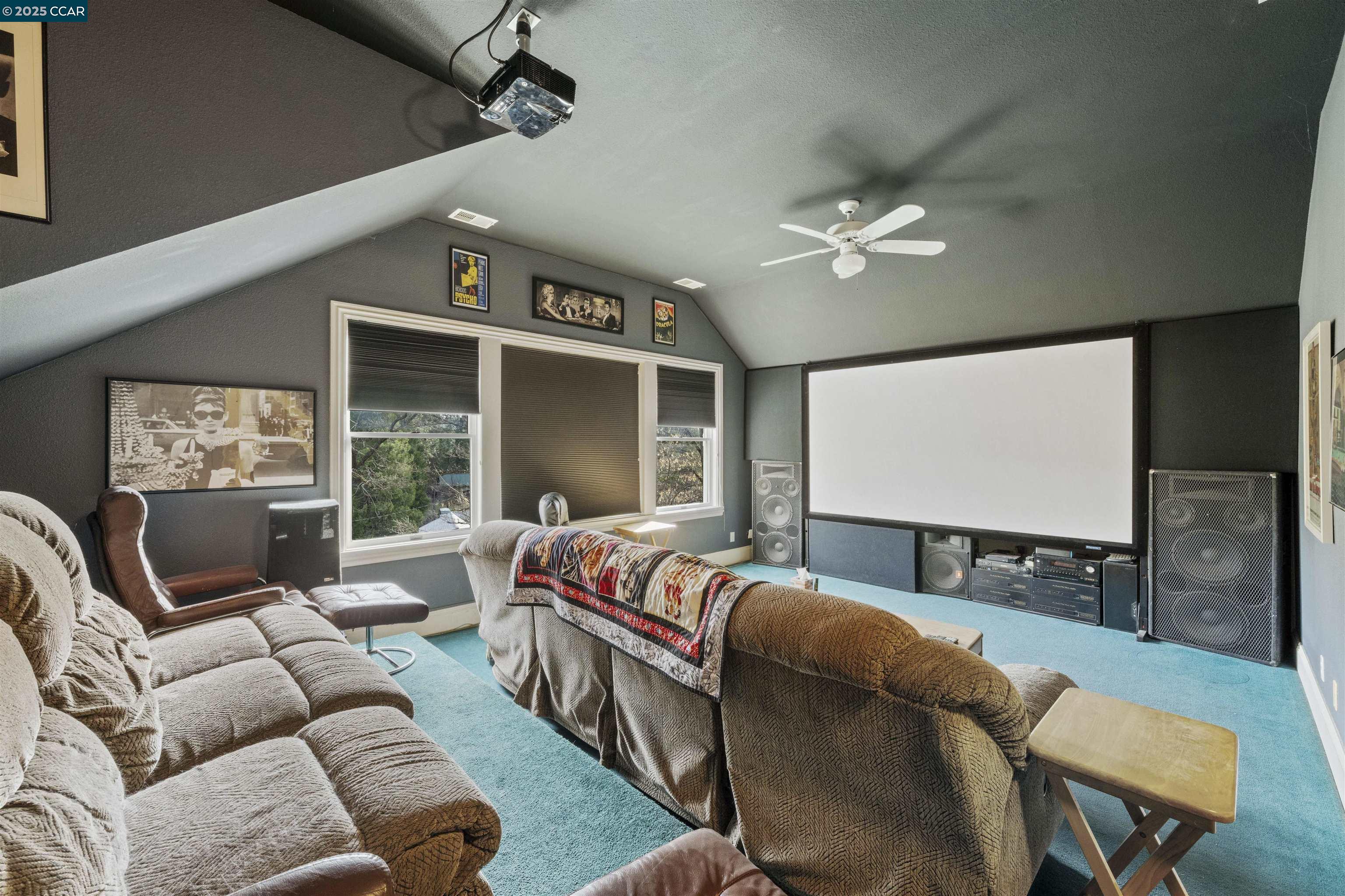 11417 Red Dog Road Nevada City, CA 95959 - Photo 18 of 56 a projector room with furniture ceiling fan and a rug