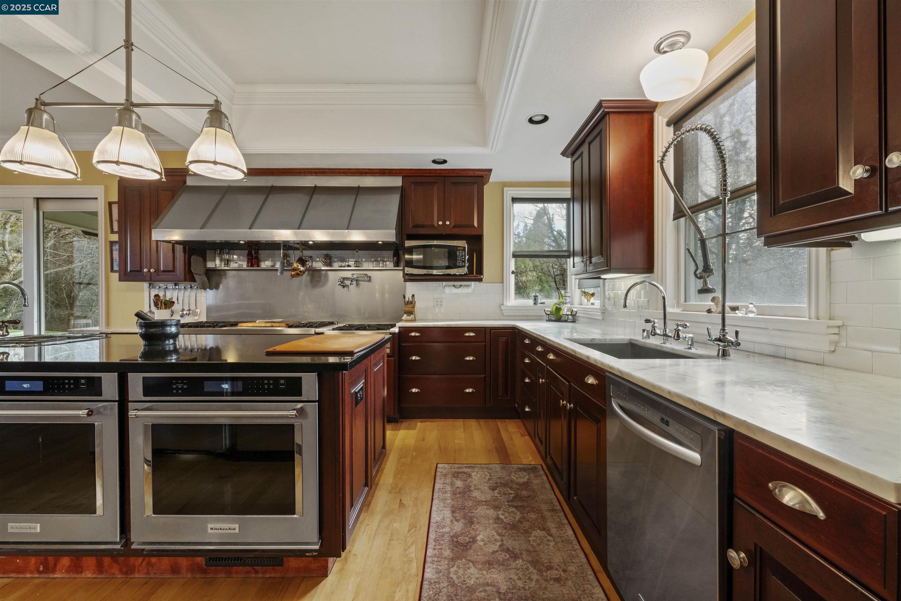 11417 Red Dog Road Nevada City, CA 95959 - Photo 2 of 56 a kitchen with stainless steel appliances granite countertop a stove a sink and a microwave