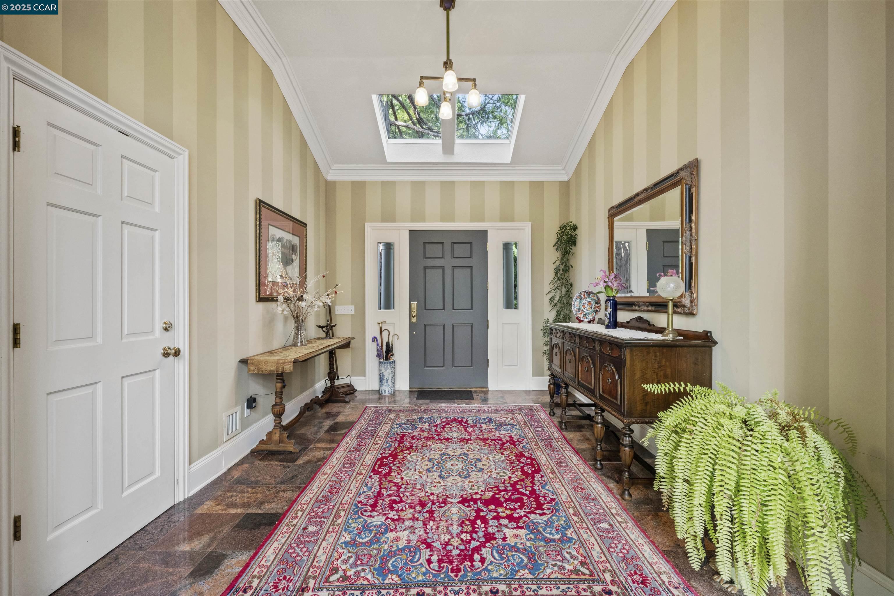 11417 Red Dog Road Nevada City, CA 95959 - Photo 25 of 56 a living room with a couch and a chandelier