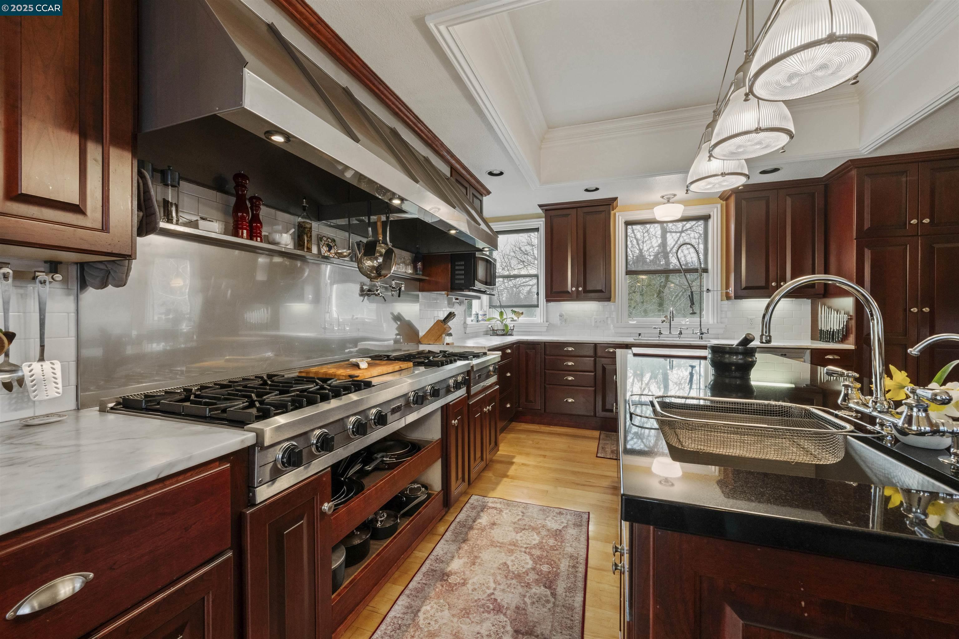 11417 Red Dog Road Nevada City, CA 95959 - Photo 3 of 56 a kitchen with stainless steel appliances granite countertop a stove a sink and a microwave