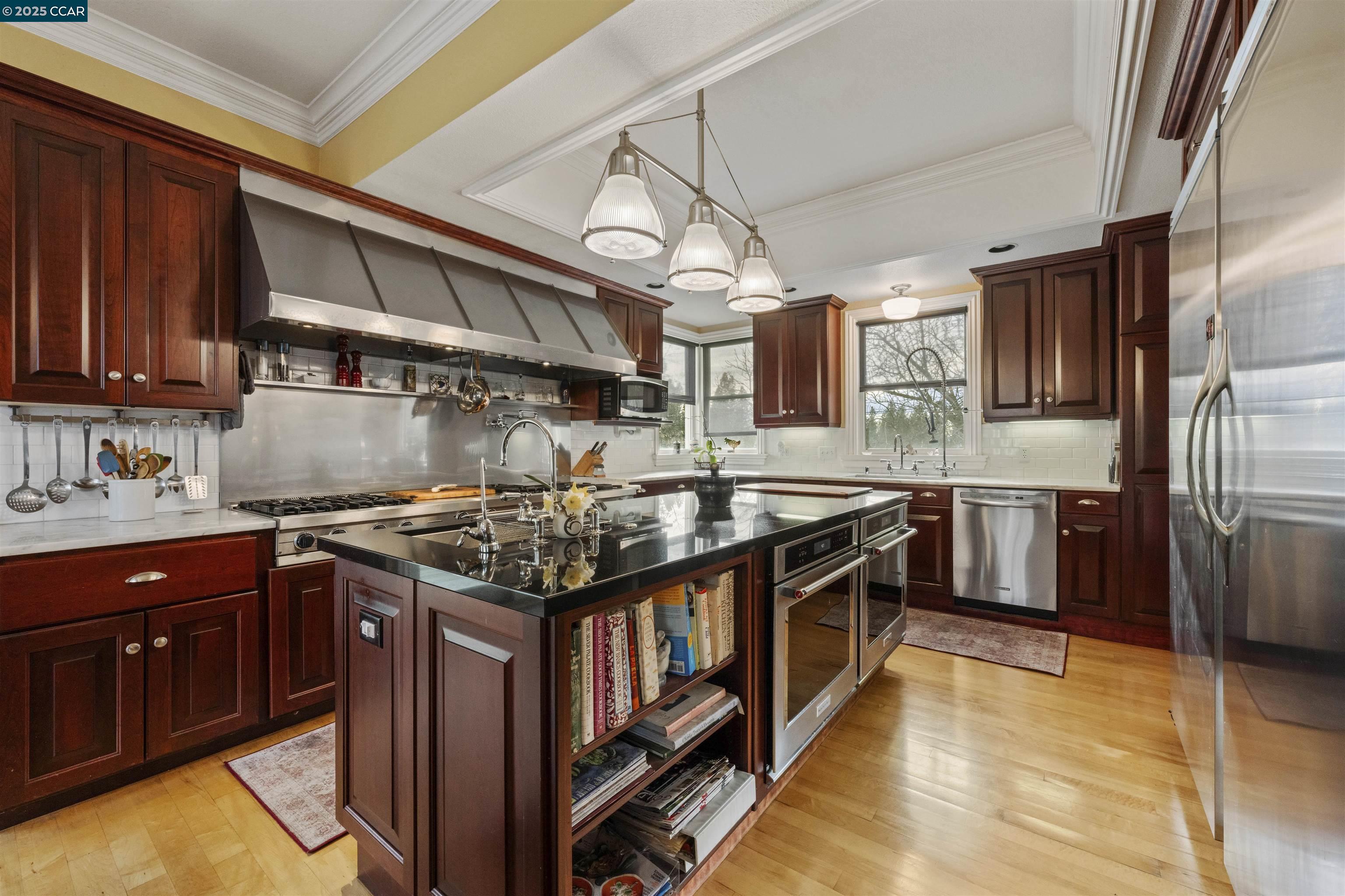 11417 Red Dog Road Nevada City, CA 95959 - Photo 7 of 56 a kitchen with stainless steel appliances granite countertop a stove a sink and a refrigerator