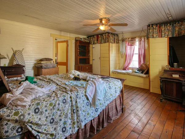 a bathroom with a toilet and shower curtain