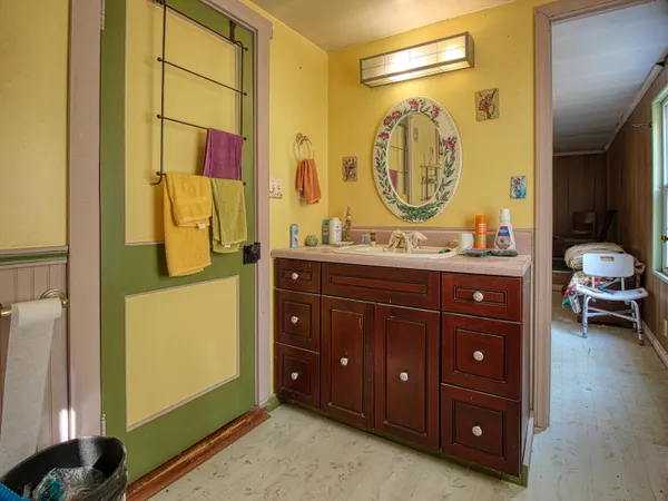 a view of room with furniture and wooden floor