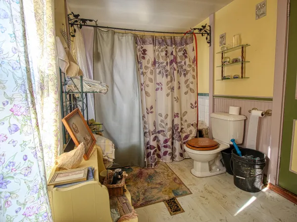 a bedroom with a bed and a table in it