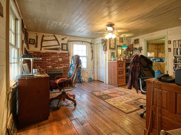 a view of a entryway door of the house and wooden floor