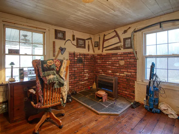 a living room with furniture window and a flat screen tv