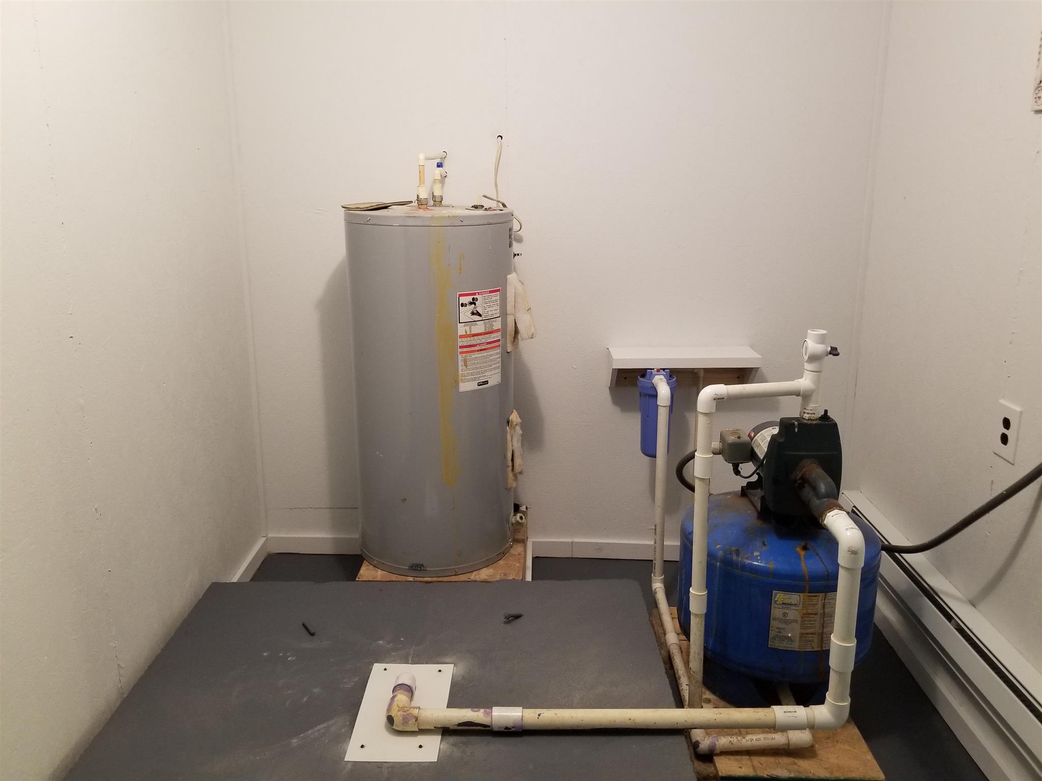 285 Buzzard Cave Road Waverly, TN 37185 - Photo 11 of 25 Utility area with water heater and well pump