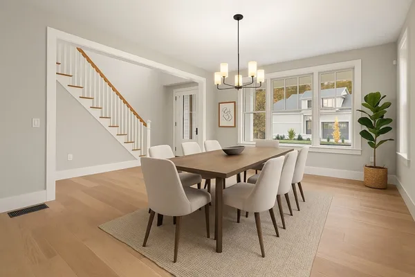 a view of a dining room with furniture window and wooden floor