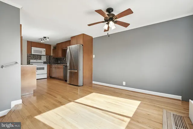 a view of a livingroom with a kitchen