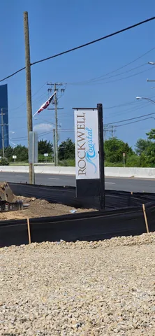 a view of a street with a building in the background