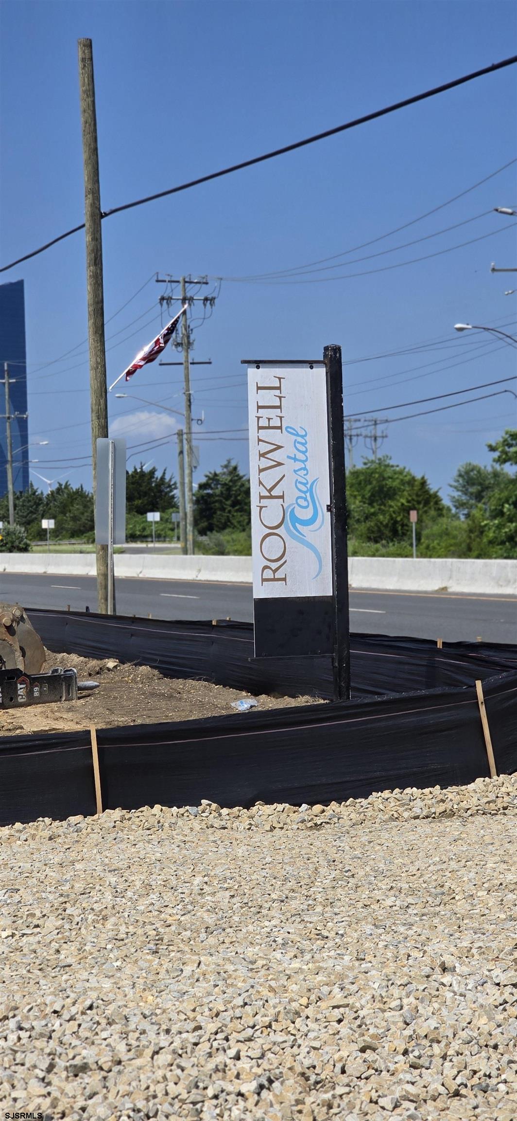 a view of a street with a building in the background