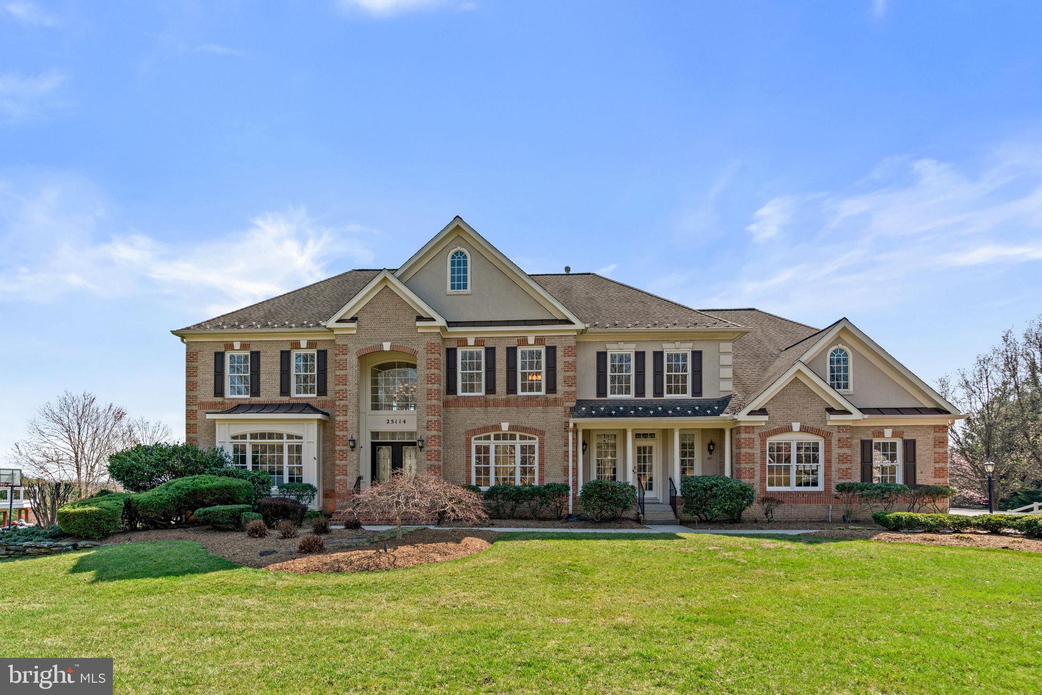 25114 Vista Ridge Road Laytonsville, MD 20882 - Photo 2 of 97 a front view of a house with a yard