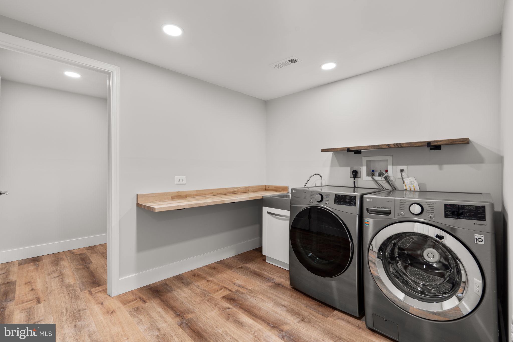 25114 Vista Ridge Road Laytonsville, MD 20882 - Photo 47 of 97 a utility room with sink dryer and washer