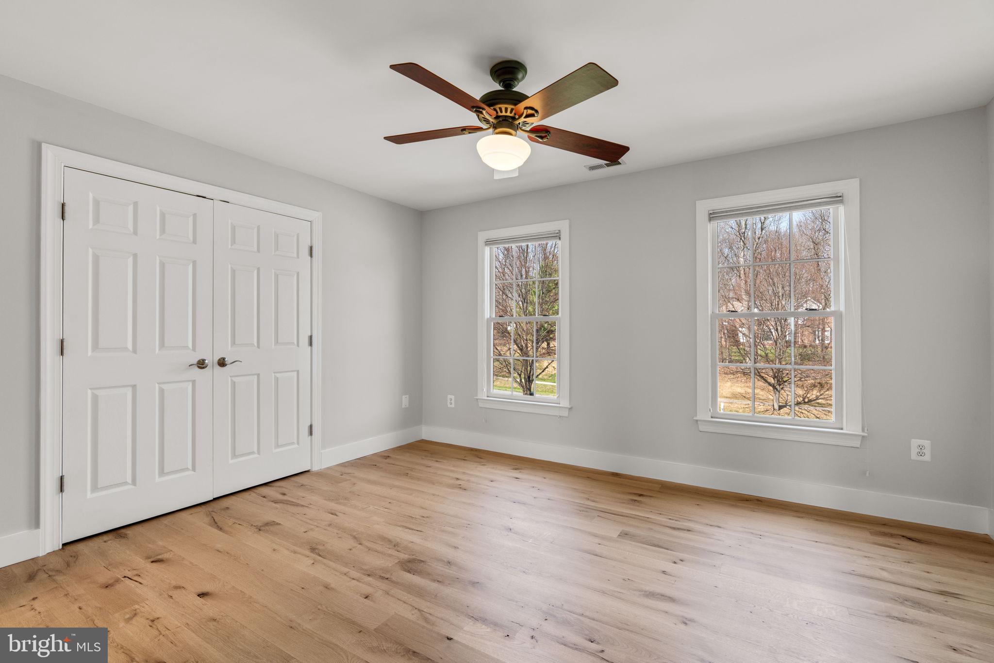 25114 Vista Ridge Road Laytonsville, MD 20882 - Photo 54 of 97 a view of an empty room with wooden floor and a window