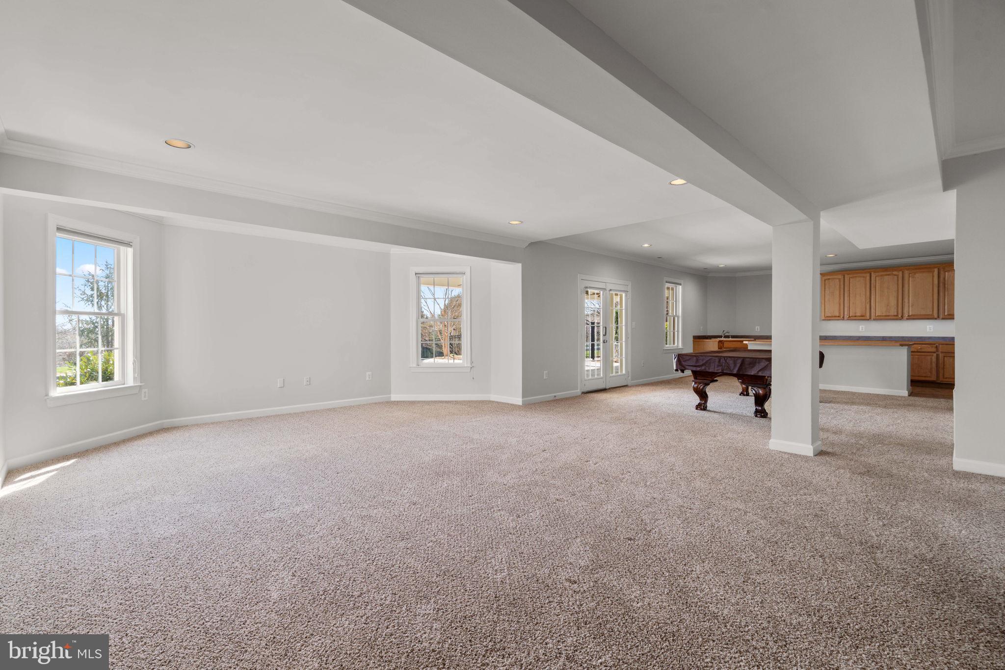 25114 Vista Ridge Road Laytonsville, MD 20882 - Photo 58 of 97 a view of a livingroom with a flat screen tv a window and a fireplace