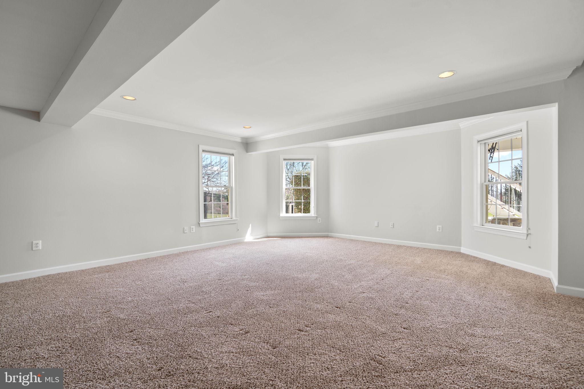 25114 Vista Ridge Road Laytonsville, MD 20882 - Photo 59 of 97 a view of a big room with windows and chandelier fan