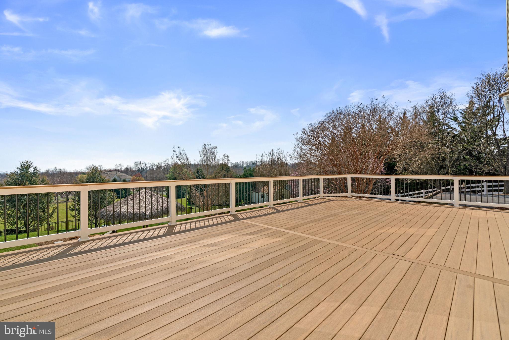 25114 Vista Ridge Road Laytonsville, MD 20882 - Photo 72 of 97 a view of a balcony with wooden floor and city view
