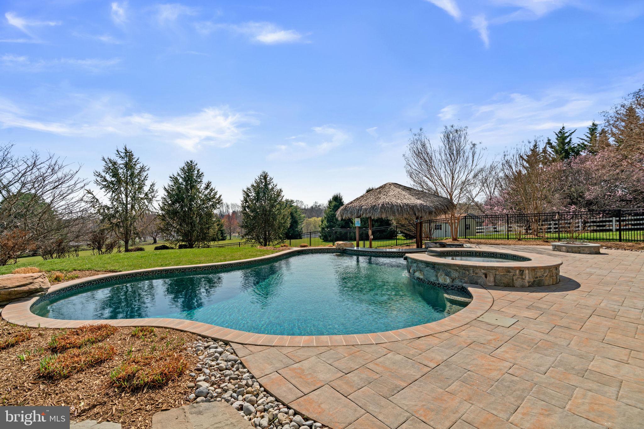 25114 Vista Ridge Road Laytonsville, MD 20882 - Photo 79 of 97 a view of swimming pool with outdoor seating and yard in back