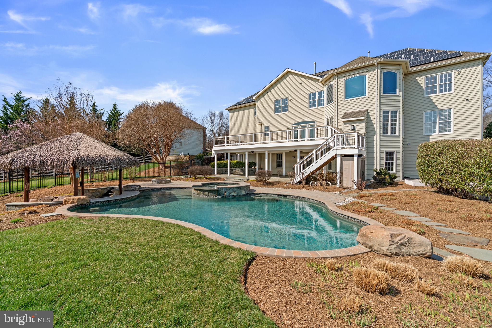 25114 Vista Ridge Road Laytonsville, MD 20882 - Photo 80 of 97 a view of a house with swimming pool and sitting area