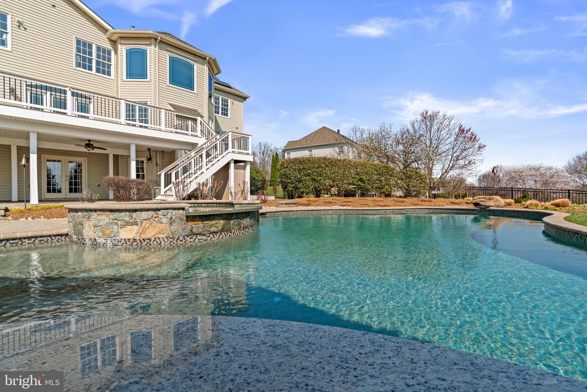25114 Vista Ridge Road Laytonsville, MD 20882 - Photo 82 of 97 a view of a lake with a house in the background