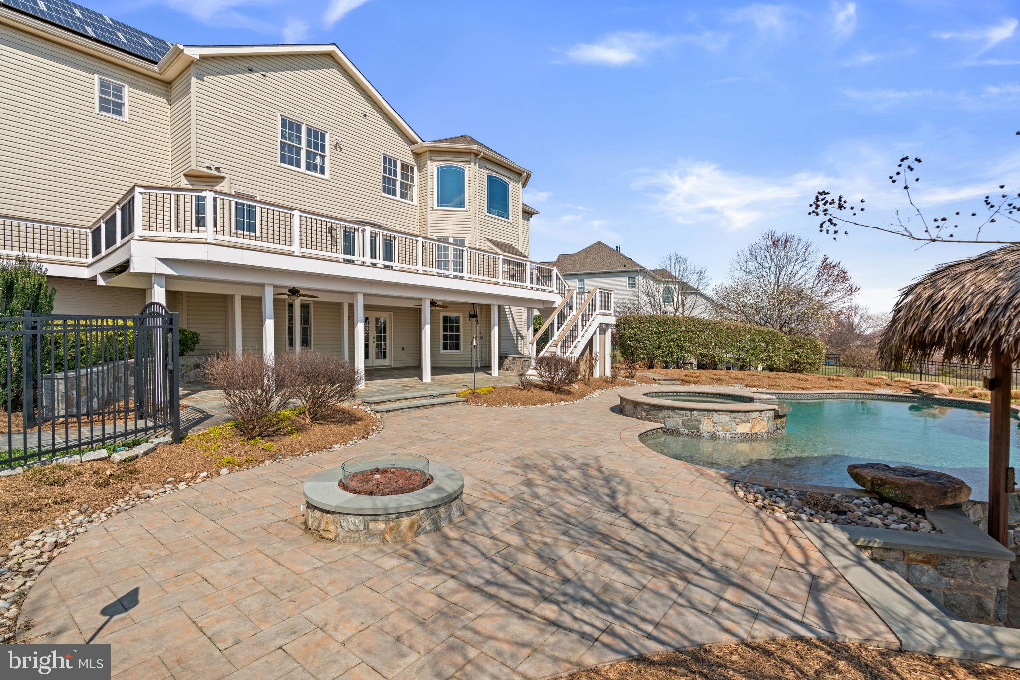 25114 Vista Ridge Road Laytonsville, MD 20882 - Photo 83 of 97 a view of a house with swimming pool and sitting area