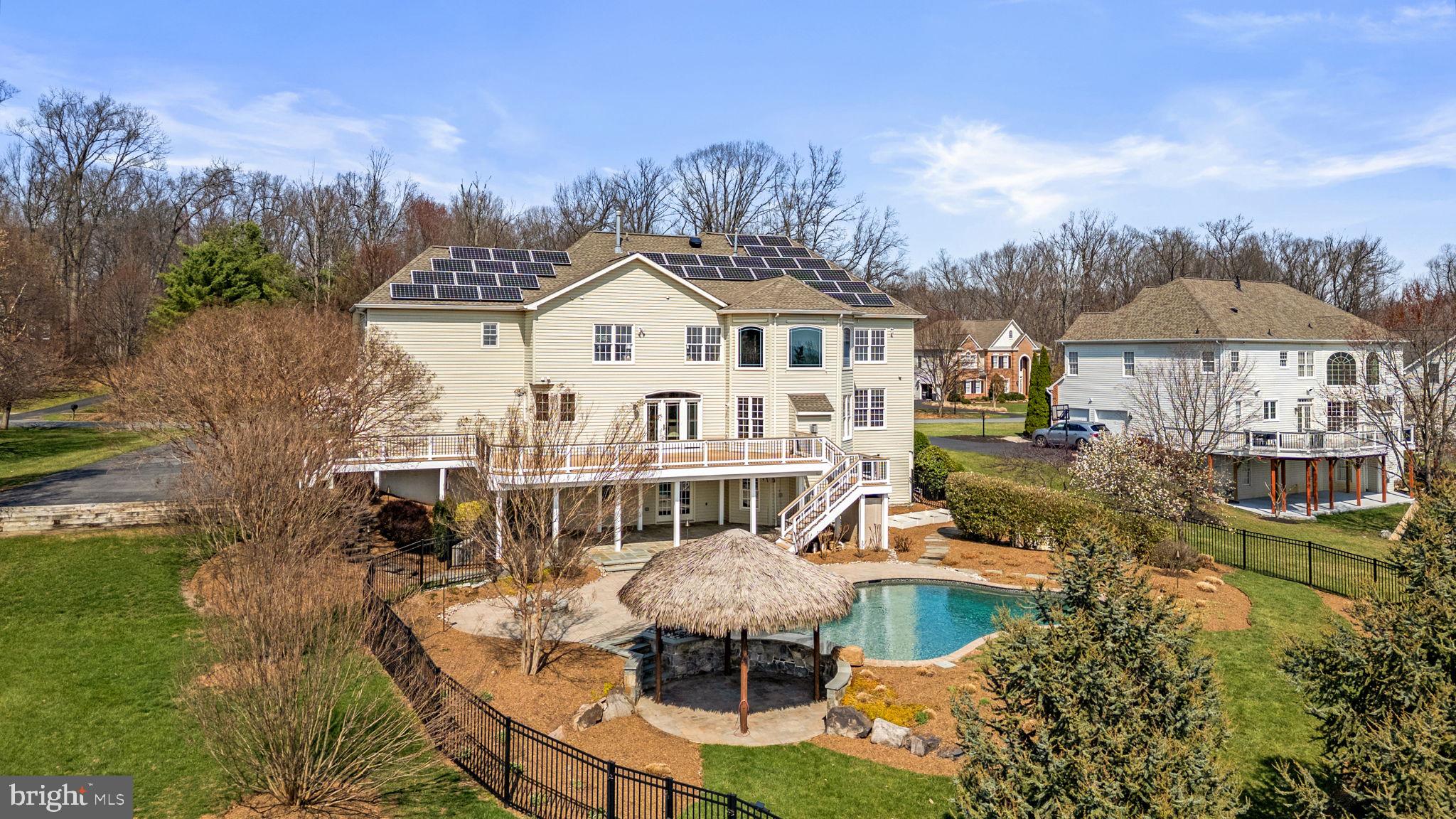 25114 Vista Ridge Road Laytonsville, MD 20882 - Photo 85 of 97 a front view of a house with a garden and lake view