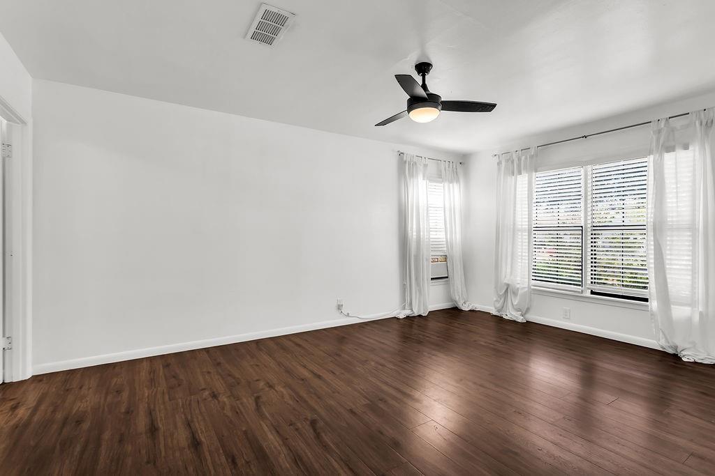 9440 Magnolia Road Frisco, TX 75033 - Photo 12 of 29 wooden floor in an empty room with a window