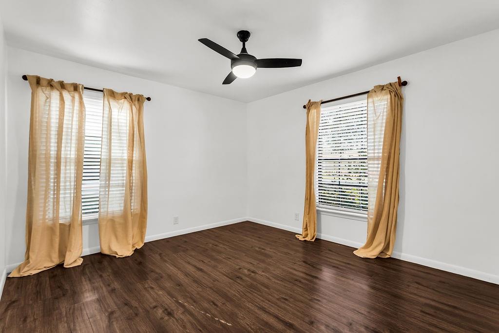 9440 Magnolia Road Frisco, TX 75033 - Photo 16 of 29 an empty room with wooden floor and windows
