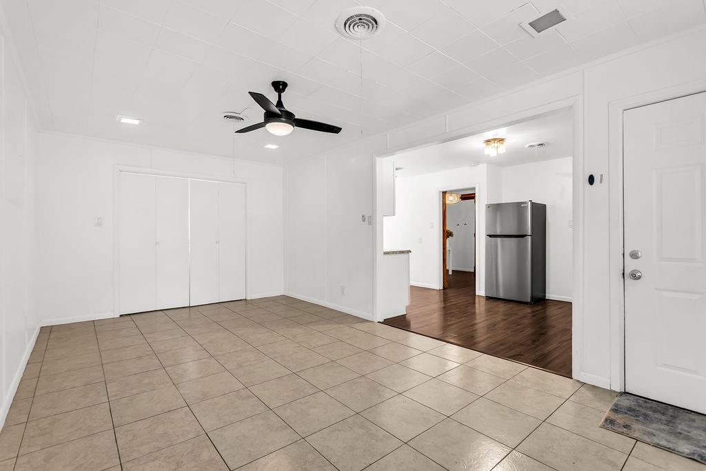 9440 Magnolia Road Frisco, TX 75033 - Photo 20 of 29 a view of a kitchen with a refrigerator and a stove top oven