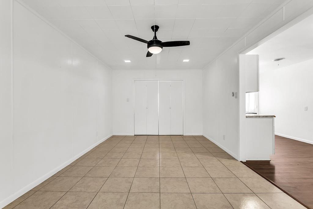 9440 Magnolia Road Frisco, TX 75033 - Photo 21 of 29 a view of a livingroom with a ceiling fan and window