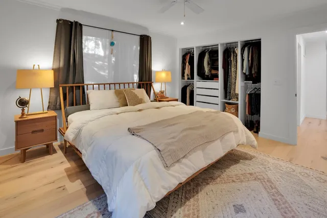 a bedroom with a bed and a dresser