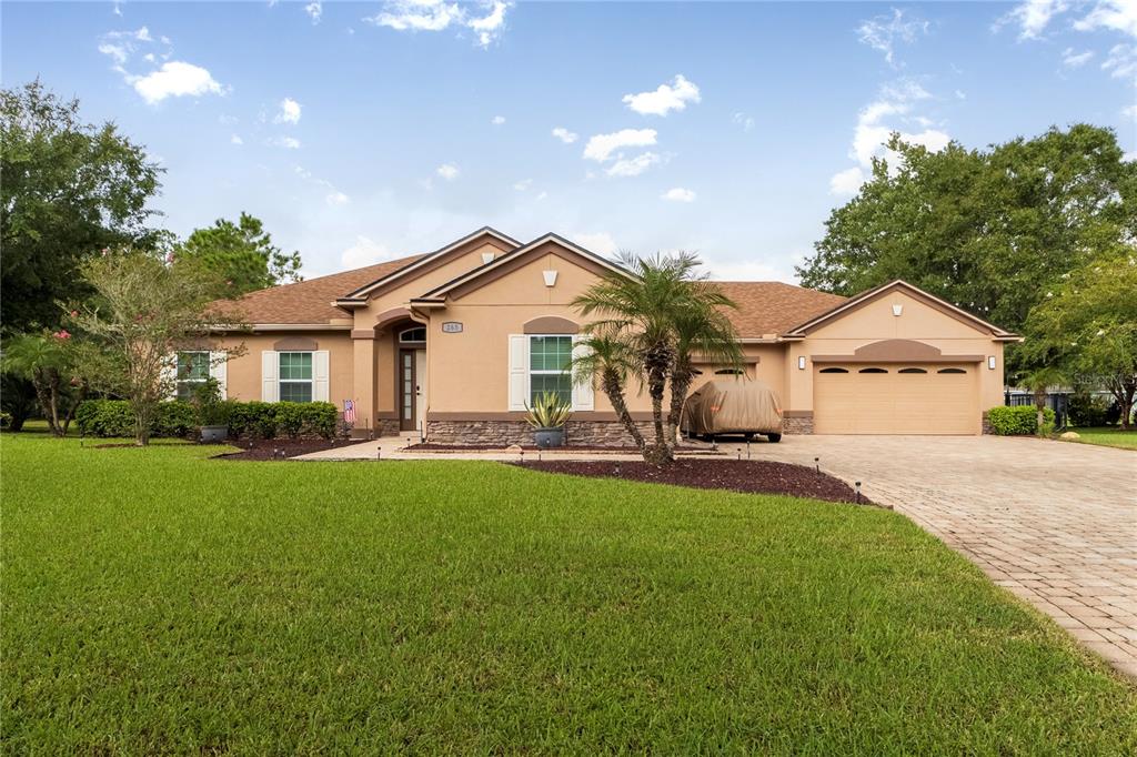 a front view of a house with a garden and porch
