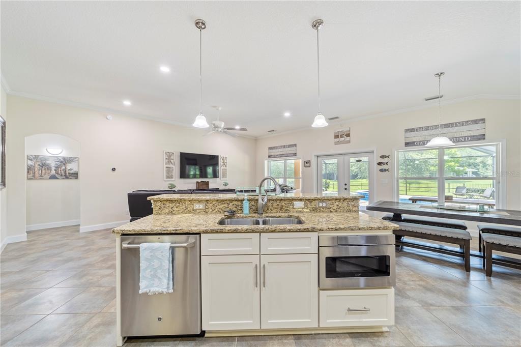 265 Pinehurst Pointe Drive St. Augustine, FL 32092 - Photo 20 of 66 a kitchen with a stove a sink and a wooden floor