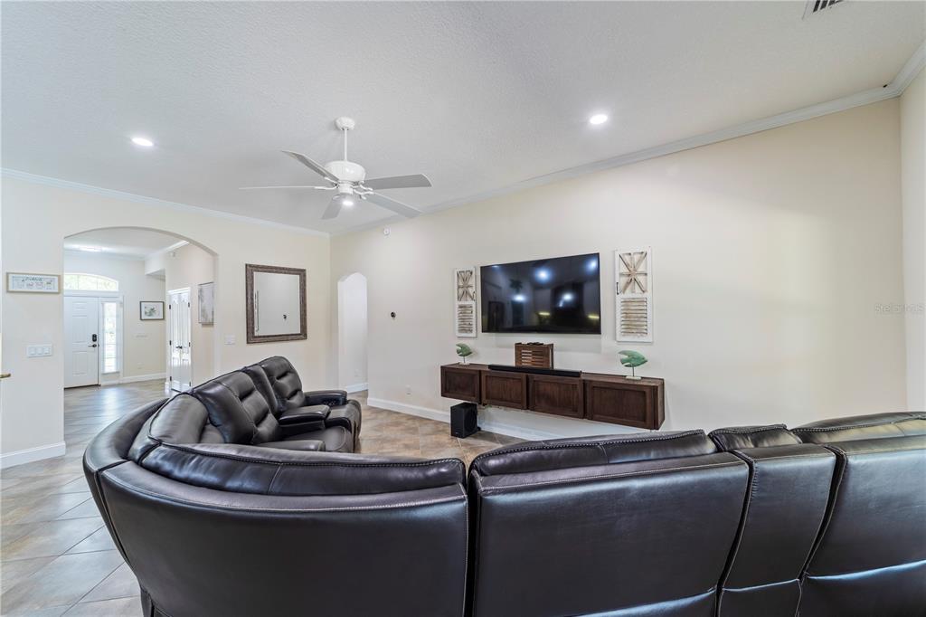 265 Pinehurst Pointe Drive St. Augustine, FL 32092 - Photo 27 of 66 a living room with furniture and a flat screen tv
