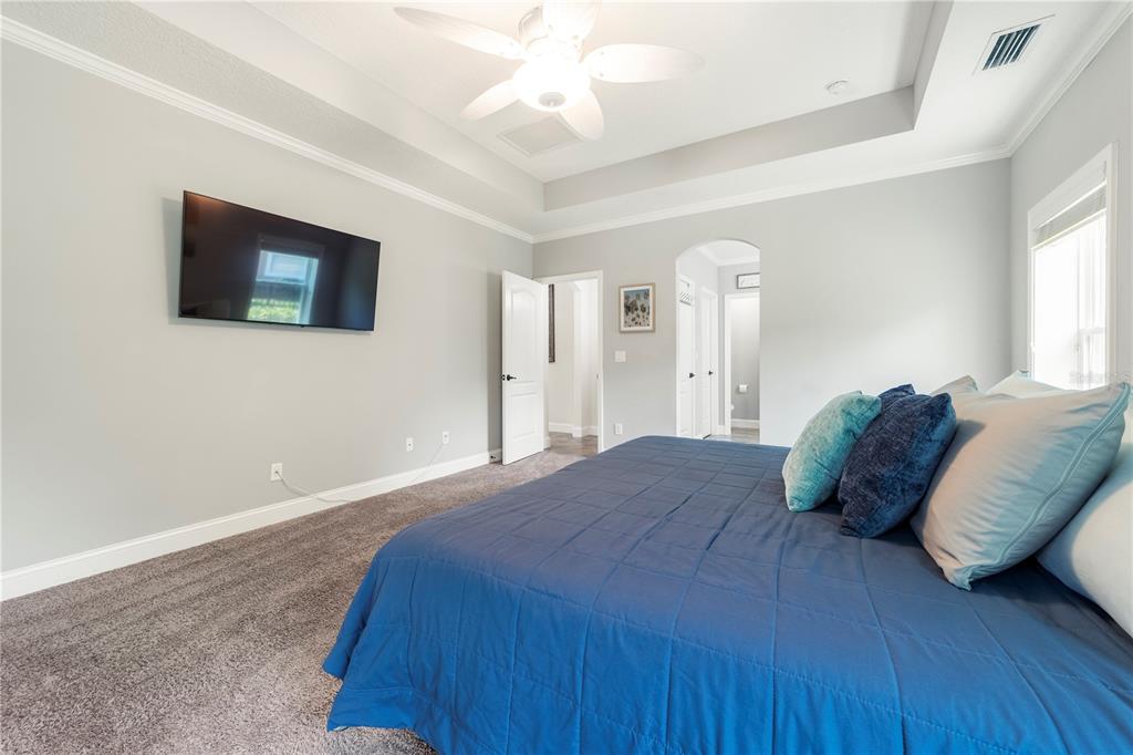 265 Pinehurst Pointe Drive St. Augustine, FL 32092 - Photo 33 of 66 a bedroom with a bed and a flat screen tv