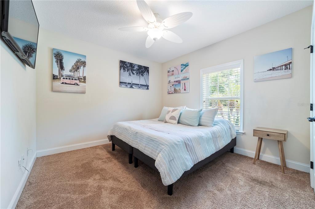 265 Pinehurst Pointe Drive St. Augustine, FL 32092 - Photo 40 of 66 a bedroom with a bed and a painting on the wall