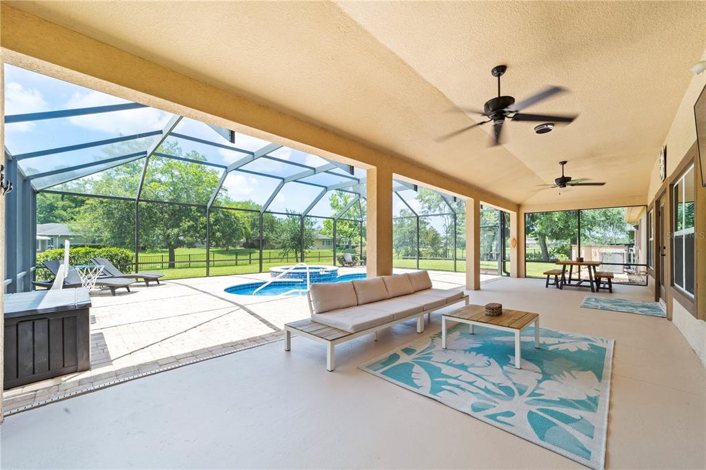 265 Pinehurst Pointe Drive St. Augustine, FL 32092 - Photo 4 of 66 a living room with furniture and a large window